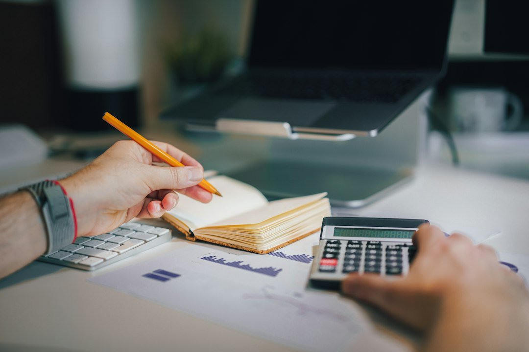 Calculator and financial planning materials used for restaurant cash flow forecasting