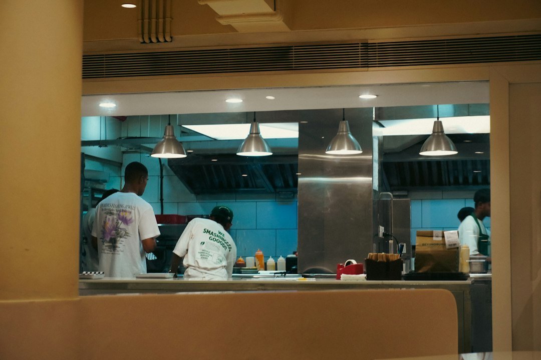 Restaurant team working in a commercial kitchen during service planning and staffing operations