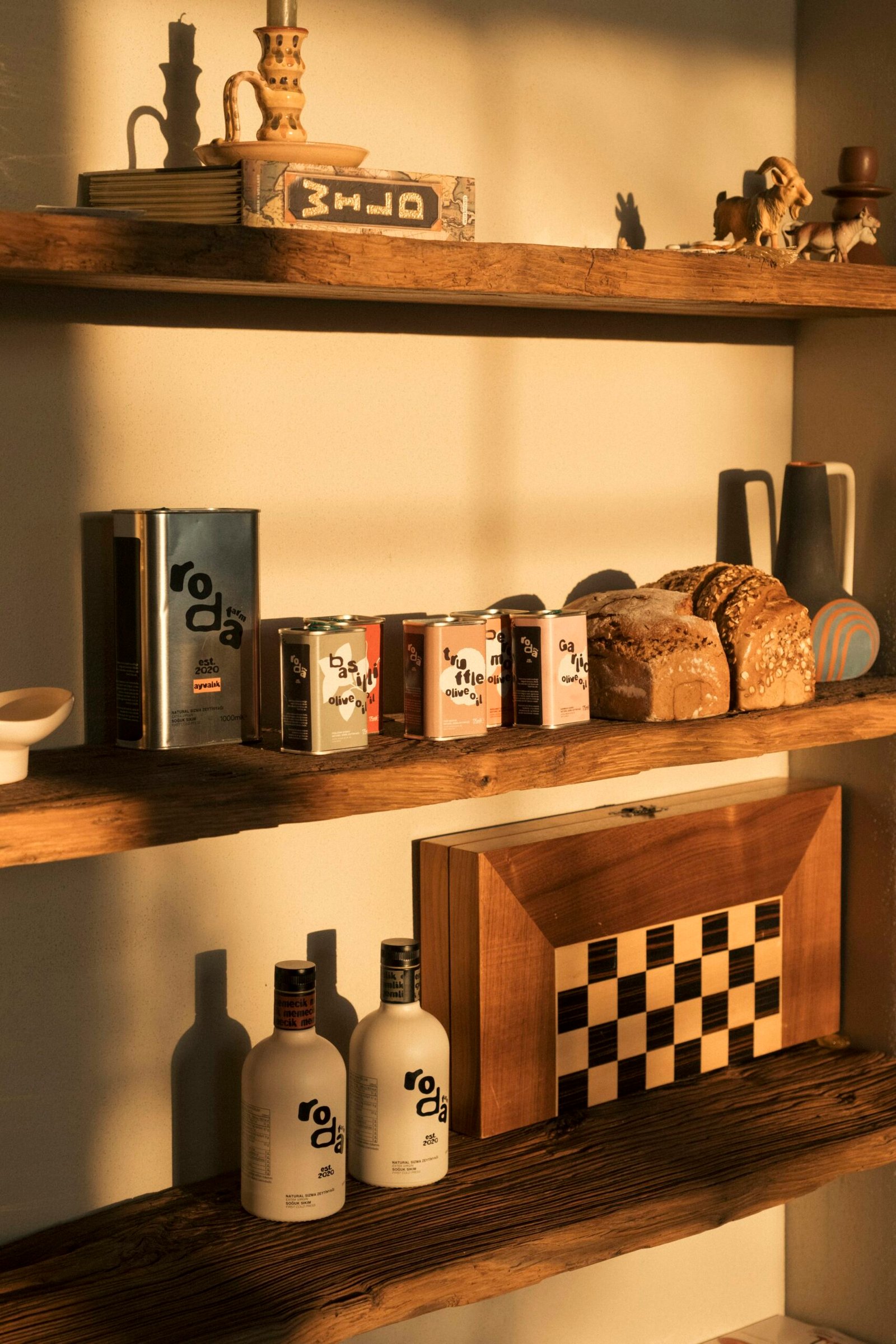 Restaurant pantry shelves with olive oil and bread representing ingredient cost and vendor price change control